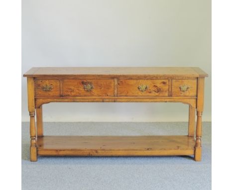 A Hatfield's 'Clifford' oak sideboard, the top with cleated ends, the frieze containing an arrangement of four short drawers 