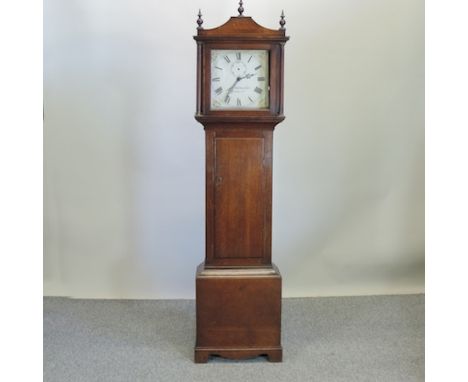 An early 19th century oak cased longcase clock, having a painted dial and thirty hour movement, 192cm tall