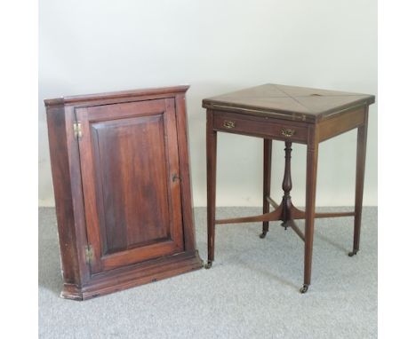 An Edwardian mahogany envelope card table, 55cm, together with a 19th century oak corner cabinet