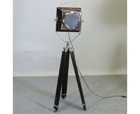 A standard lamp, in the form of a stage light, on a tripod base, 130cm tall
