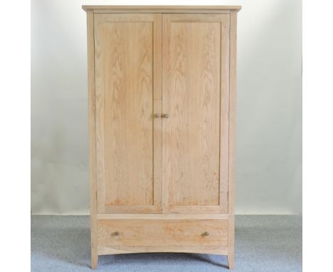 A Heals light oak wardrobe, with a single drawer below, 110cm