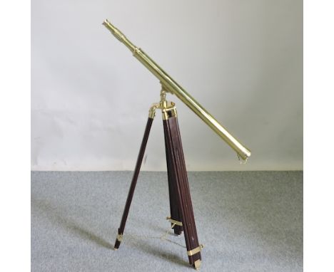A brass telescope, on tripod stand, 96cm