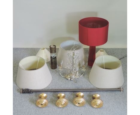 A red glass table lamp and shade, 71cm tall overall, together with a set of four gilt painted curtain tie backs, various lamp