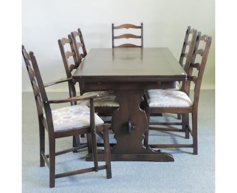 An Ercol dining table, together with a set of eight dining chairs