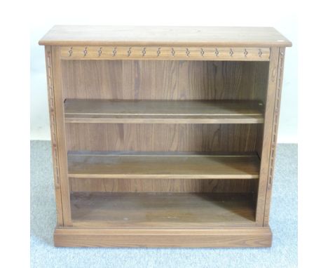 An Ercol elm dwarf open bookcase, 96cm