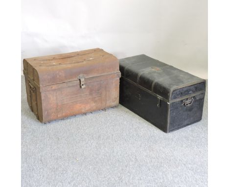 A black painted metal trunk, 76cm, together with another trunk