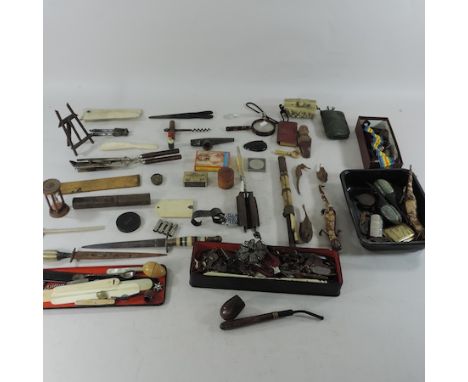 A box of items, to include costume jewellery, a corkscrew, carved figures etc