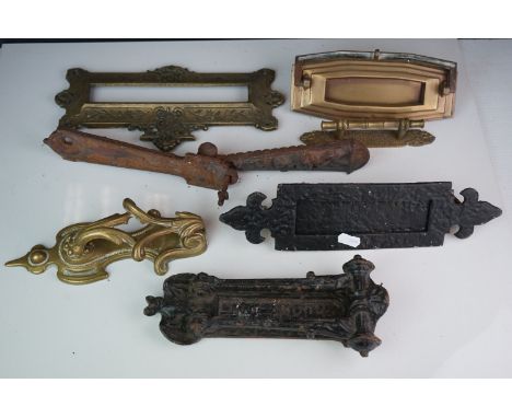 A collection of vintage door furniture to include door knockers and letter boxes. 