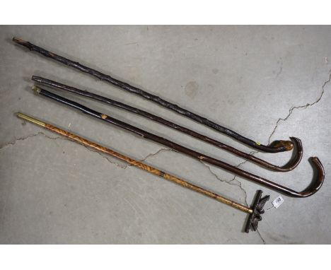 A collection of vintage country walking sticks. 