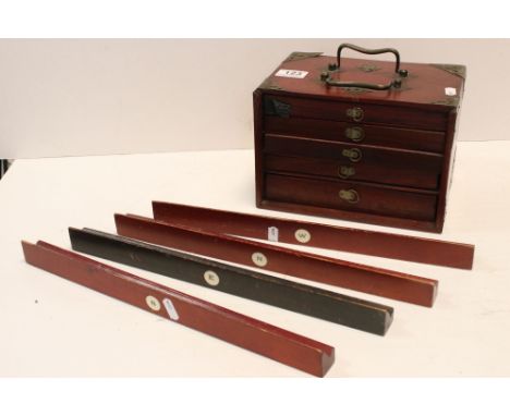 An antique Mahjong set contained with a wooden cabinet with carrying handles together with four tile stands. 