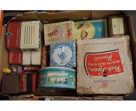 A box of vintage advertising tins. 