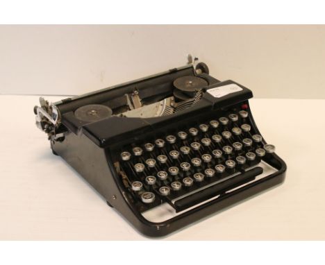 An early 20th century black typewriter no makers name. 