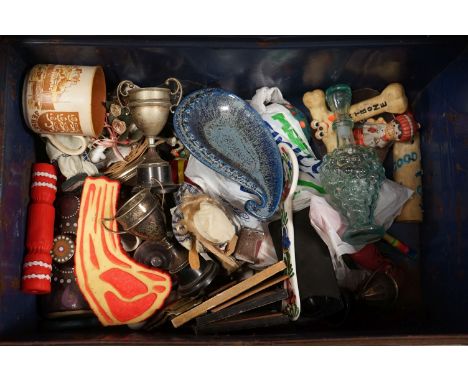 A vintage metal steamer trunk with contents to include trophies and mixed ceramics. 