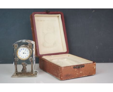 An Edwardian rock crystal clock with decorative white enamel dial, complete with original box. (A/F). 