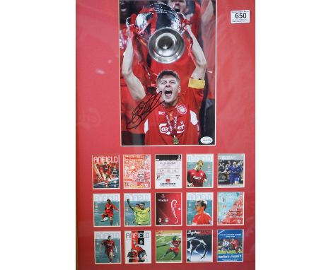 Football Autographs - Framed &amp; glazed Liverpool FC Champions League programme montage signed by Steven Gerrard on photo l