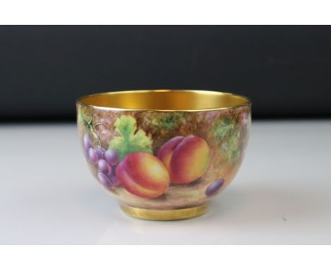A late 20th century Royal Worcester bowl with gilded interior and berry and fruit decoration signed Leaman. 