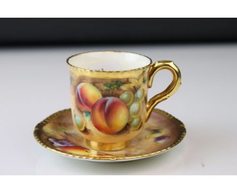 A contemporary Royal Worcester cup and saucer with fruit decoration signed F Roberts. 