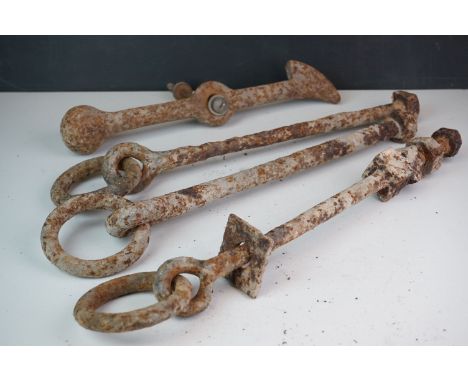 Three vintage wrought iron tethering bolts together with a wrought iron latch. 