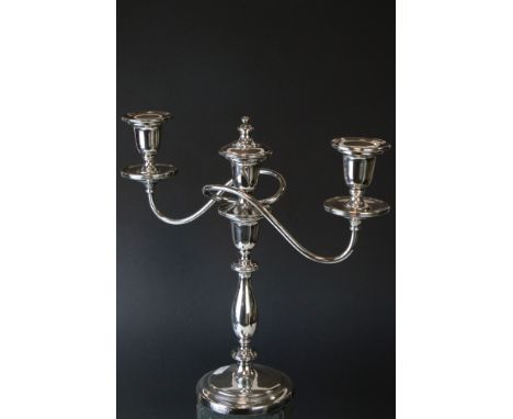 A Mappin and Webb silver plated three branch candlestick with snuffer. 