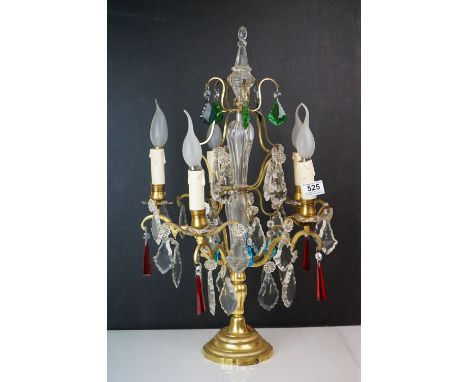 An early 20th century brass lamp with hanging glass droplets. 