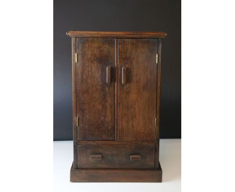 A vintage miniature mahogany cupboard with a single drawer. Height approx 44cm. 