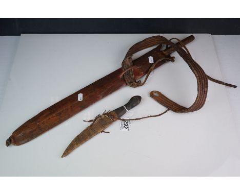 Two vintage african edged weapons to include a sword and a knife. 