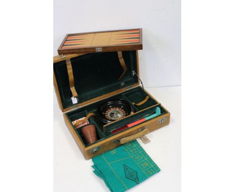 A cased games compendium to include Roulette wheel and backgammon board. 