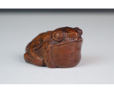 A carved wood netsuke in the form of a toad #. 