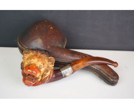 A Meerschaum pipe in the form of a lion with a hallmarked silver collar, complete with original case. 