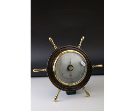 A mid 20th century barometer in form of a oak cased and brass ships wheel. 