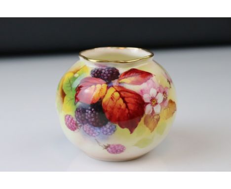A Royal Worcester vase of squat form decorated with Berries and Leaves signed K Blake. 