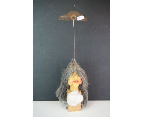 A 20th century puppet head in the form of an old lady. 