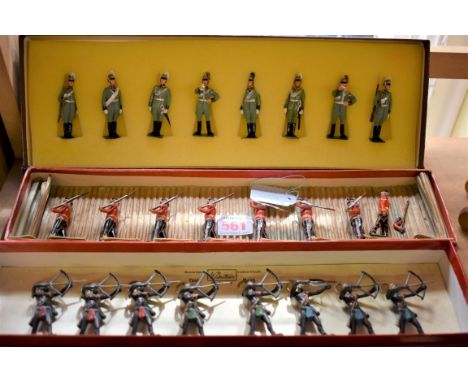 Britains:&nbsp;a vintage set of 'The Highland Light Infantry', in incorrect box; together with a set of eight vintage 'Togola