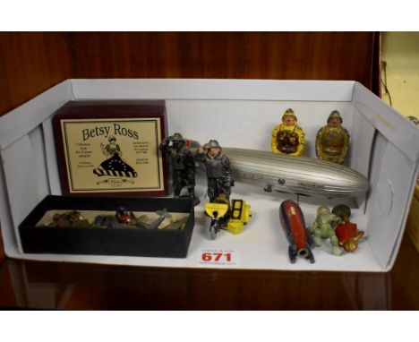 A small collection of vintage diecast figures,&nbsp;to include two Britains RNLI Lifeboatmen; two by Johillco; a spaceman, ro