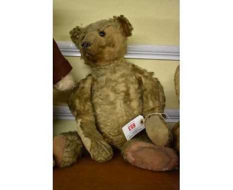 A vintage mohair teddy bear,&nbsp;straw filled, with hump back, 51cm long. 