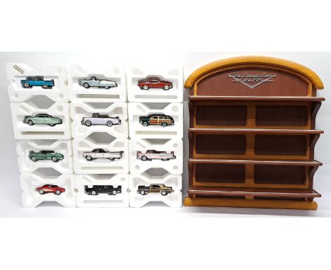 Franklin Mint, The Classic Cars of the Fifties, 1:43 scale Cars (12) &amp; Wooden Display Cabinet. &nbsp;Although unchecked f