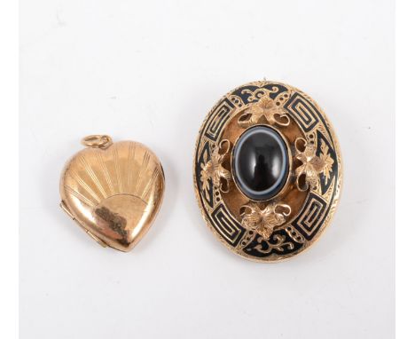 A Victorian mourning brooch, an oval cabochon cut agate collet set to the centre of an oval brooch with three raised leaf mot