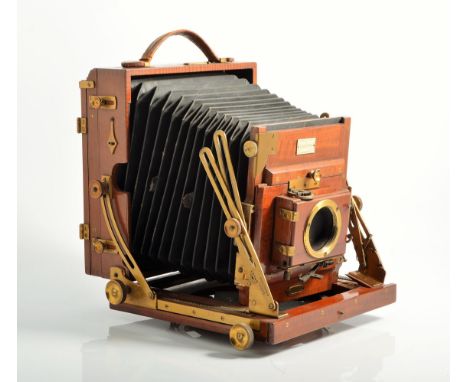 The Sanderson regular half plate mahogany field camera, (damaged), with six mahogany plates,