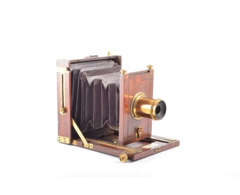 A mahogany plate camera with London Stereoscopic Co label, with Wray London 8 ½ x 6 ½ lens, reg number 534, (af)