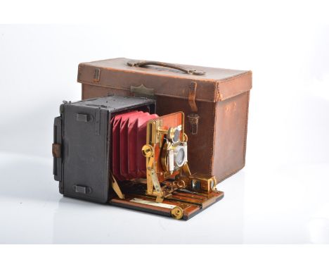 The Sanderson hand plate camera, regular model fitted with a Beck convertible alpine lens, mahogany and leather case, reg num