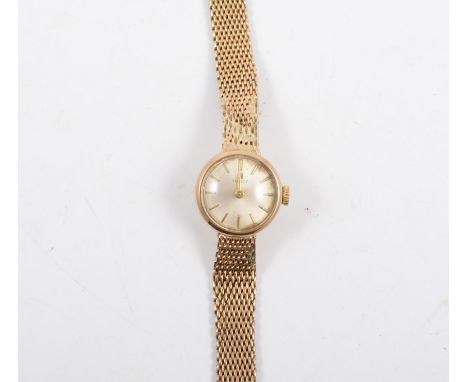 Tissot - A lady's 9 carat yellow gold bracelet watch, circular white baton dial in a 9 carat yellow gold case with repaired i