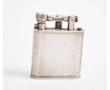 A 1940s silver Dunhill lighter, engine turned design, 4cm x 5cm, hallmarked London 1945.