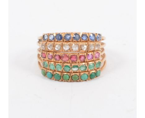 A five band gemset ring, sapphire, diamond, ruby, emerald and turquoise, each band set with eight stones in yellow metal, rin