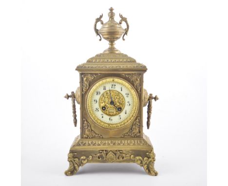 A French brass mantel clock, ivorine chapter ring, cylinder movement signed Japy Freres, striking on a bell, 41cm.