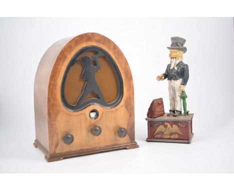 A vintage domed top radio, slope top knife/candle box, reproduction painted cast iron money box. (3)