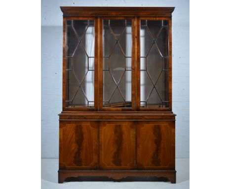 George III style mahogany bookcase, modern, dentil moulded cornice above a plain frieze, three astragal glazed doors enclosin