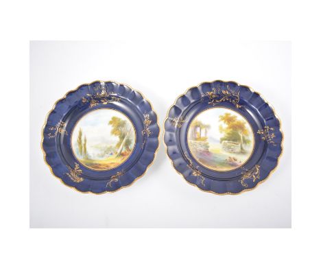 Royal Worcester, cabinet plates, cobalt blue and gilt borders, central reserve painted with landscape scene, diameter 20cm.