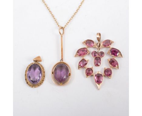 Three purple stone pendants, two set with oval mixed cut amethyst in yellow metal mounts, the third having twelve stones in a