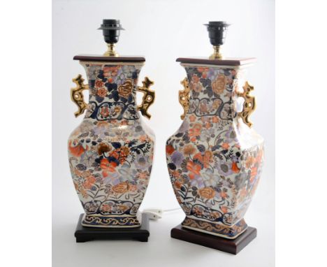 Pair of Chinese porcelain lamp bases, and a blue and white lamp base. (3)