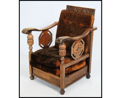 A 1930's Art Deco fireside armchair being made for an Interiors exhibition in London. The chair with tan leather back having 